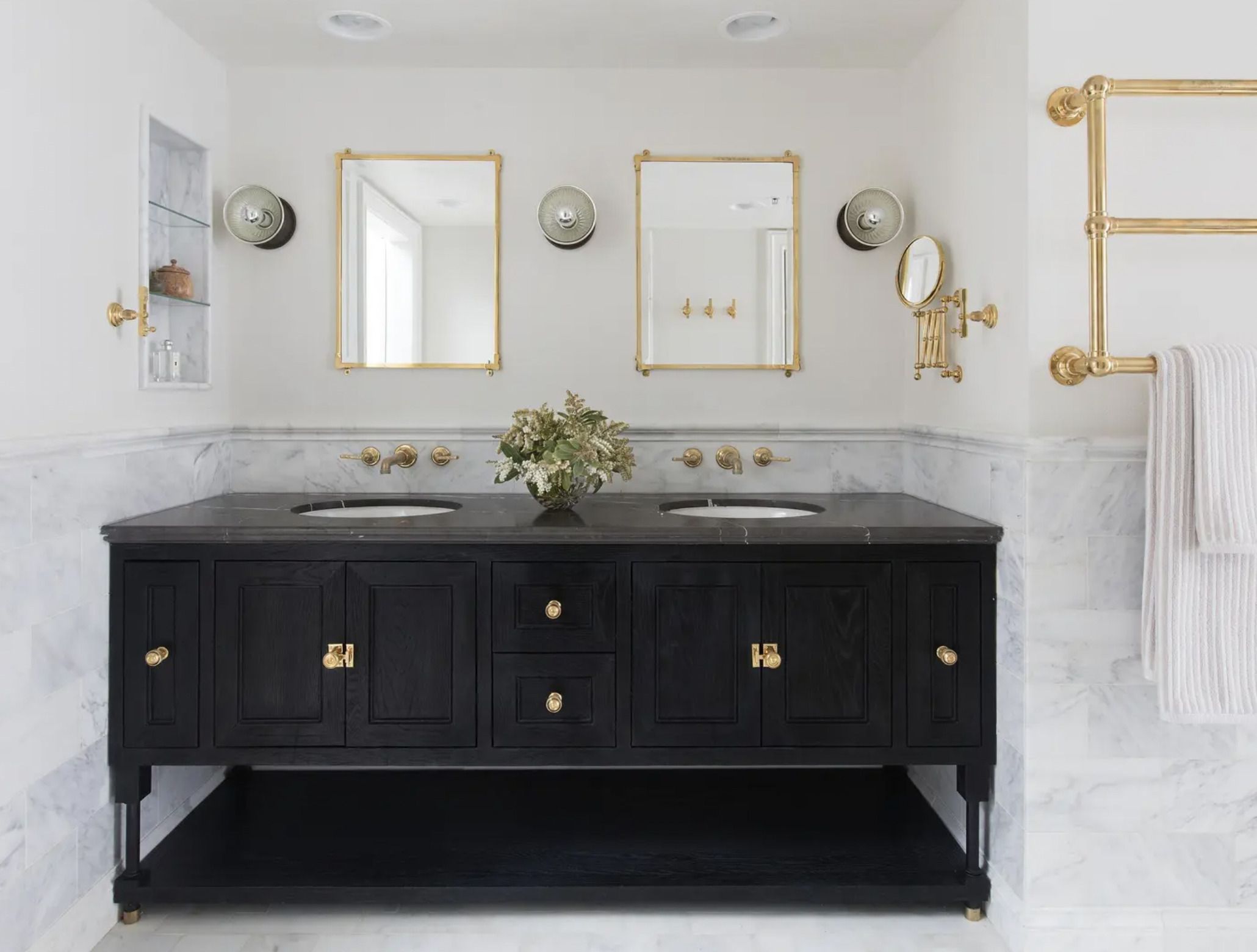 Stunning contemporary black, white and gold bathroom boasts white