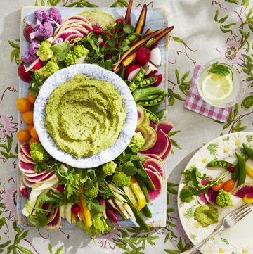 crudités board with white bean and pea dip