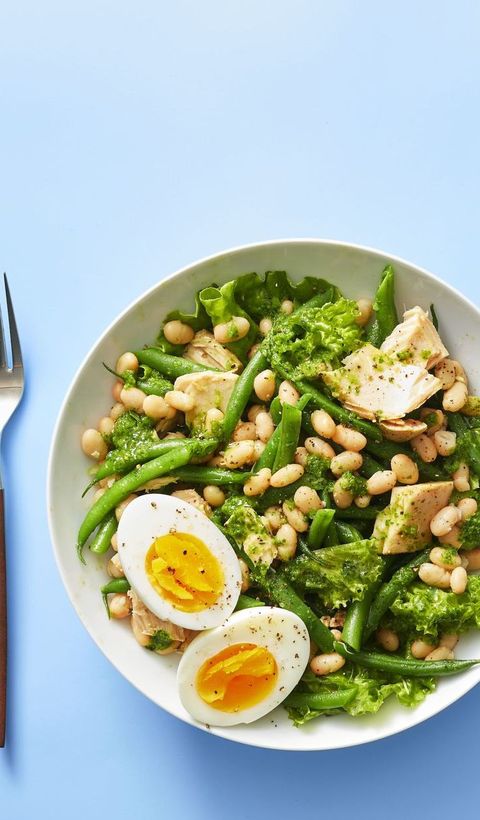 white bean and tuna salad with basil vinaigrette on a blue background