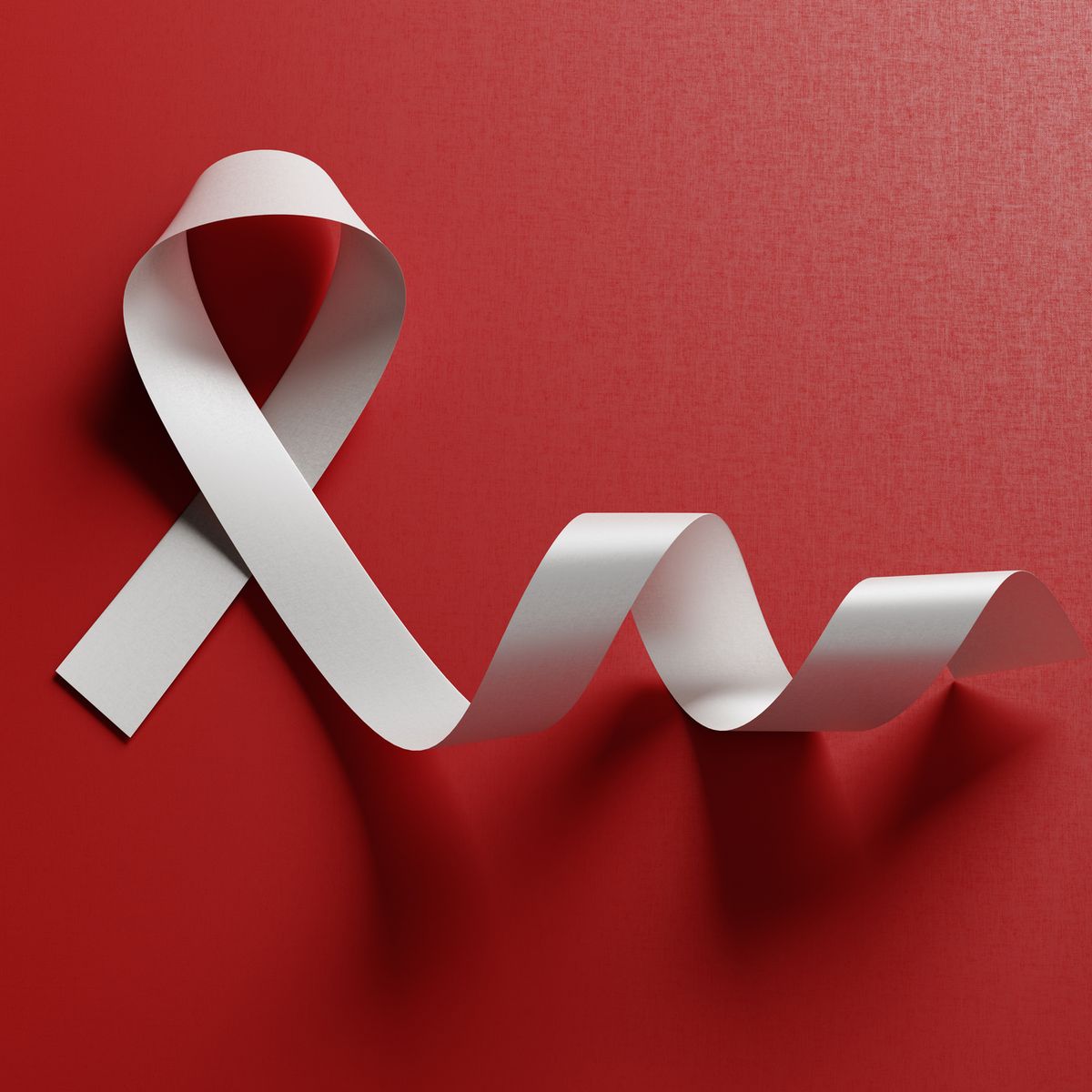 White Blindeness And Bone Cancer Awareness Ribbon On Red Background