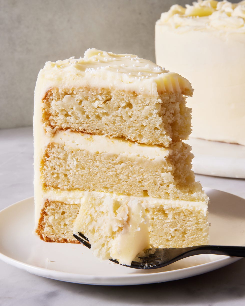 white cake with vanilla frosting and white sprinkles