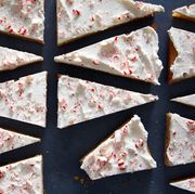 peppermint blondies cut into triangles and covered in white chocolate topped with crushed peppermint candy