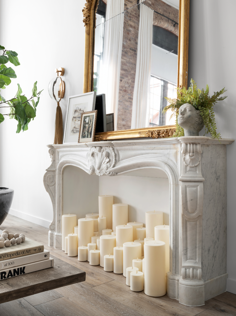 white candles in fireplace