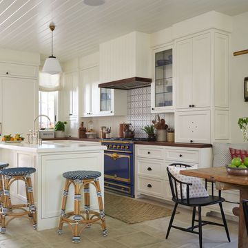 white coastal kitchen with blue and white stools