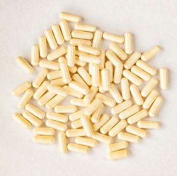 white capsules medicine pills supplement isolated on white background