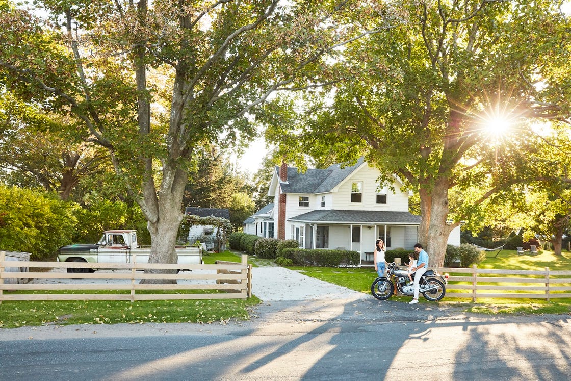 restored white modern farmhouse with vintage pickup truck