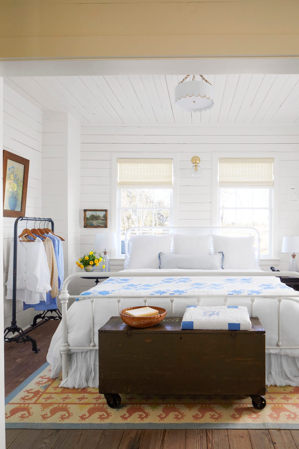 a farmhouse bedroom with white shiplap