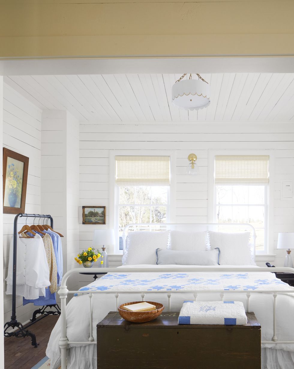 a farmhouse bedroom with white shiplap