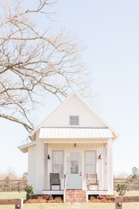 white farmhouse with light blue door