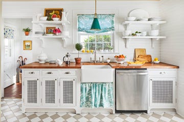 white galley kitchen with skirted sink and open shelving