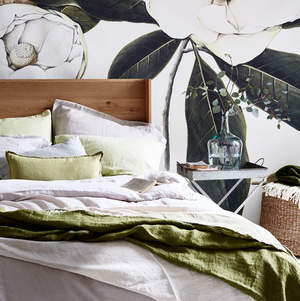white and green bedroom scheme with floral wall mural