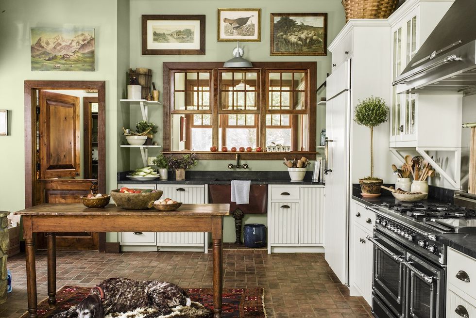 white kitchen cabinets as accent in dark kitchen