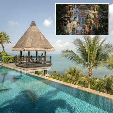 view of an infinity pool overlooking the sea with a thatched gazebo