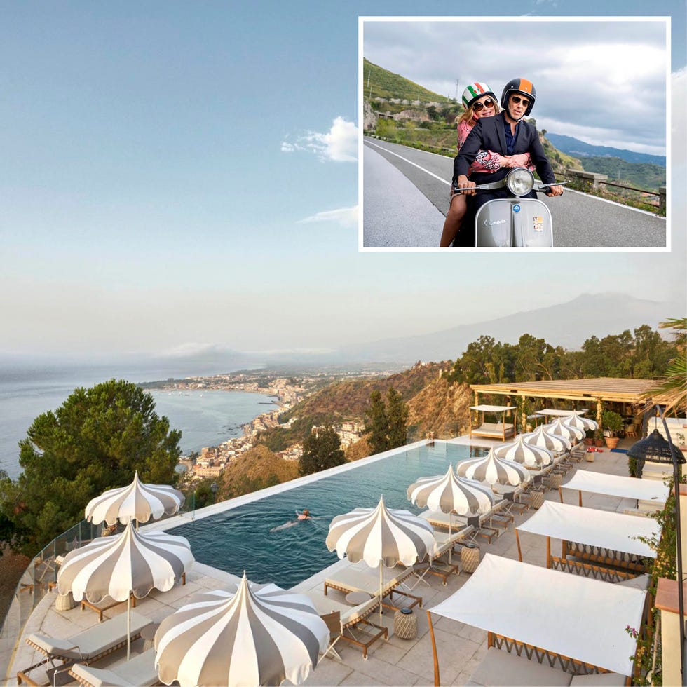 a scenic view of a luxury poolside with beach umbrellas overlooking a coastal landscape