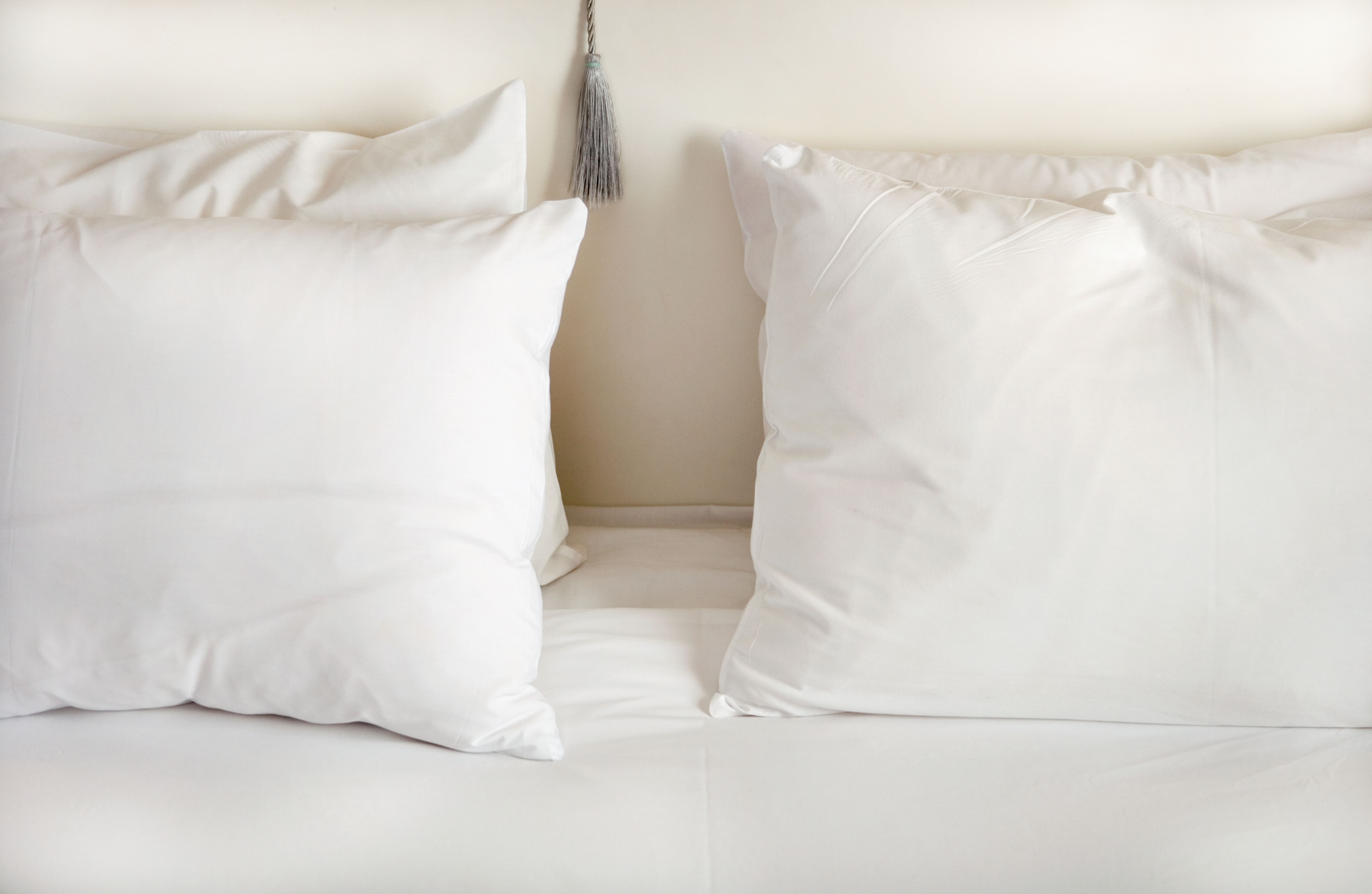 white pillows on bed