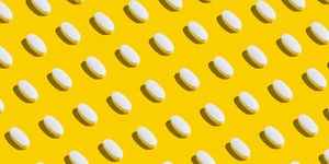 white pills on yellow background