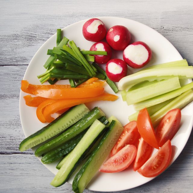 white plate with vegetables for a vegetarian salad