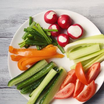 white plate with vegetables for a vegetarian salad