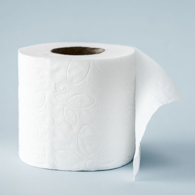 White roll toilet paper on the  light blue background