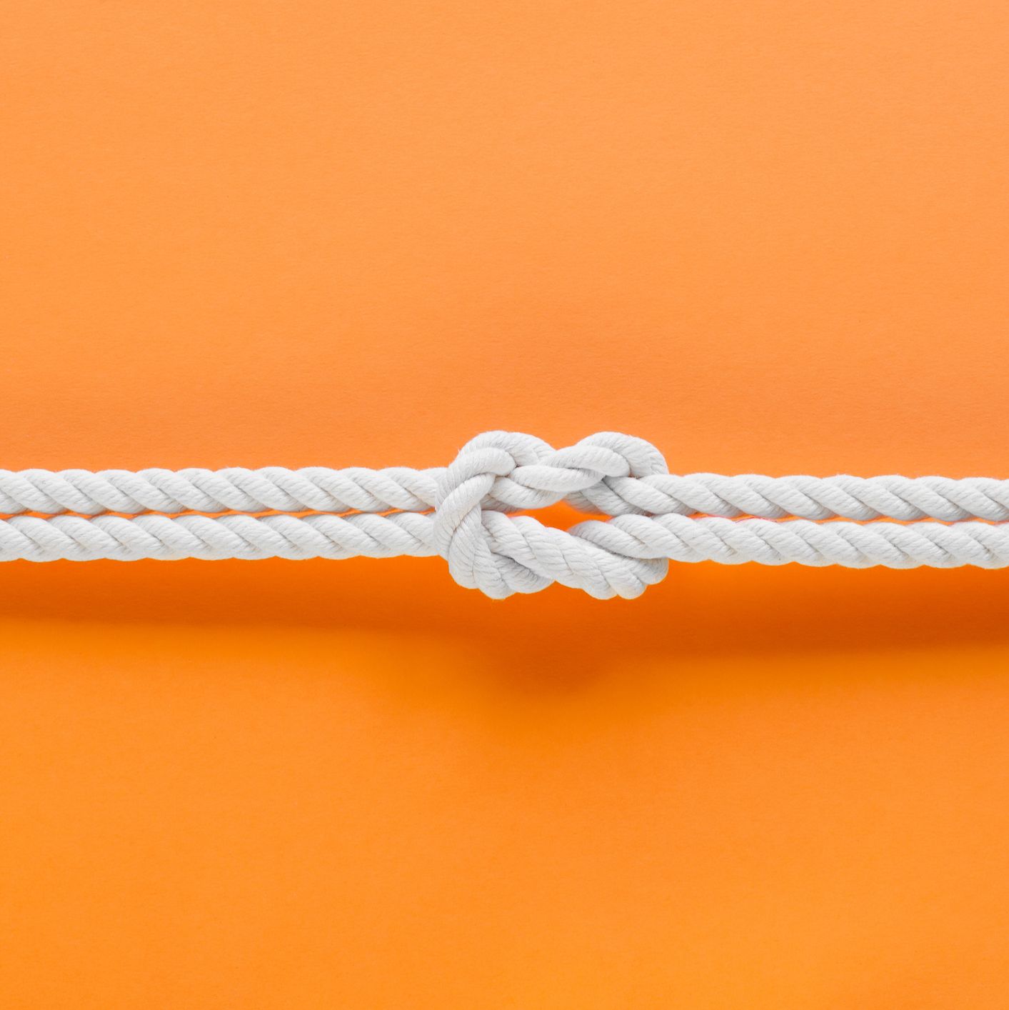 White ship ropes connected by reef knot