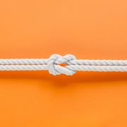 White ship ropes connected by reef knot