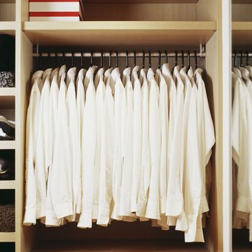 white shirts hanging in closet