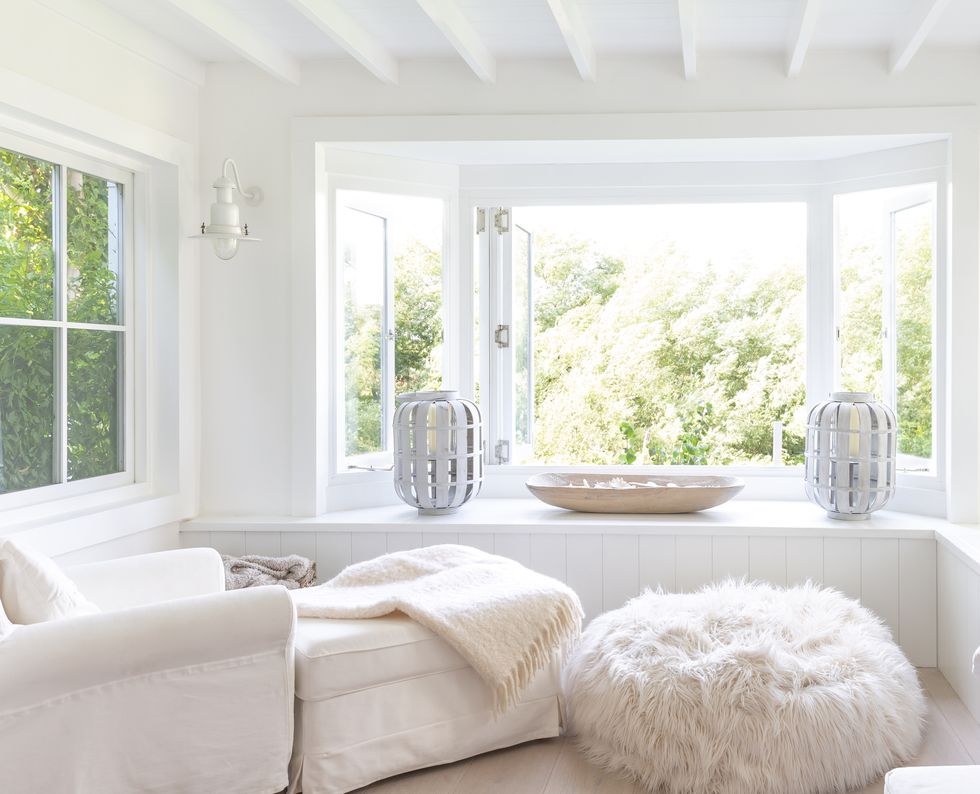 White sitting area with open windows
