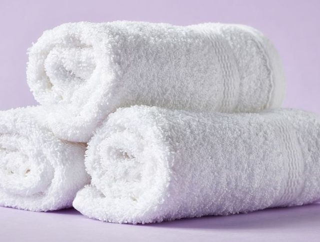 White spa towels on purple background
