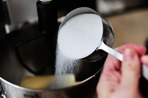 white sugar in measuring cup