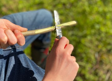 whittling with a pocket knife