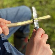 whittling with a pocket knife