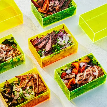 meal prepped salads in neon boxes meal prepped salads in neon boxes