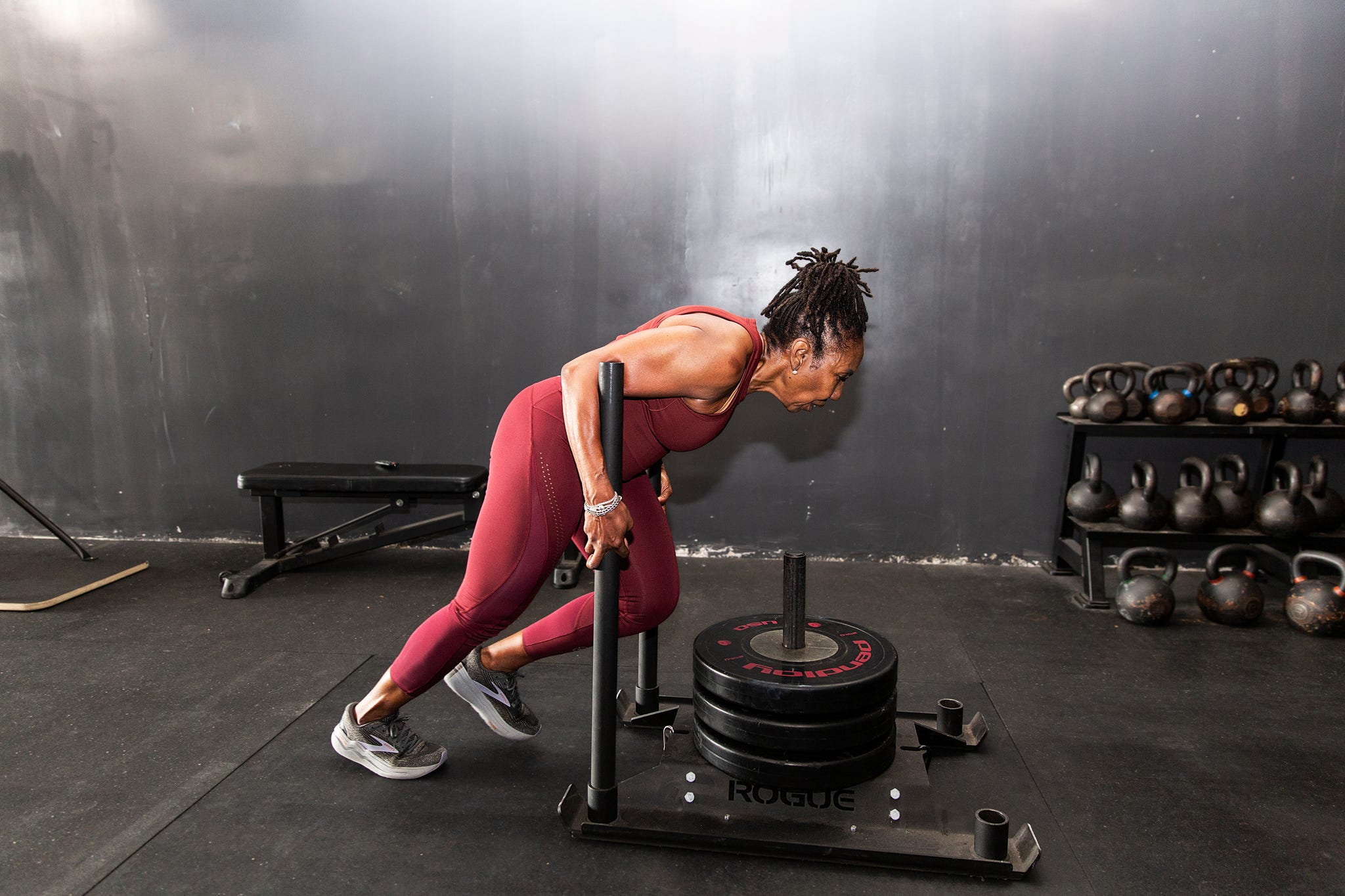 cynthia sanders pushes a weighed sled during a workout at dtx performance co in dallas, texas, on june 6, 2025.
