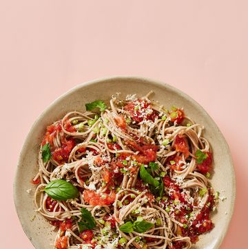 noodles covered in tomato sauce and herbs