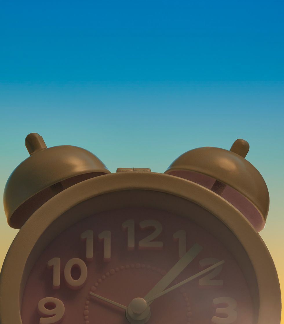 alarm clock with a sunrise background