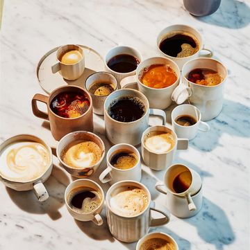 a group of coffee cups with liquid in them