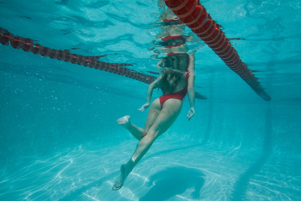 sydney sweeney swimming underwater in a pool