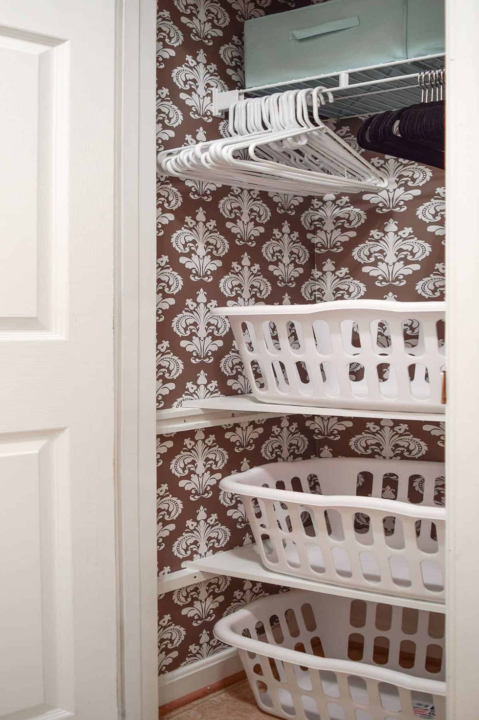 laundry baskets stacked in closet