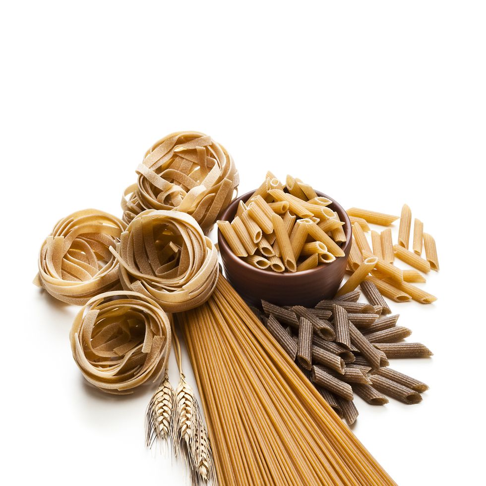 Wholegrain pasta isolated on white background