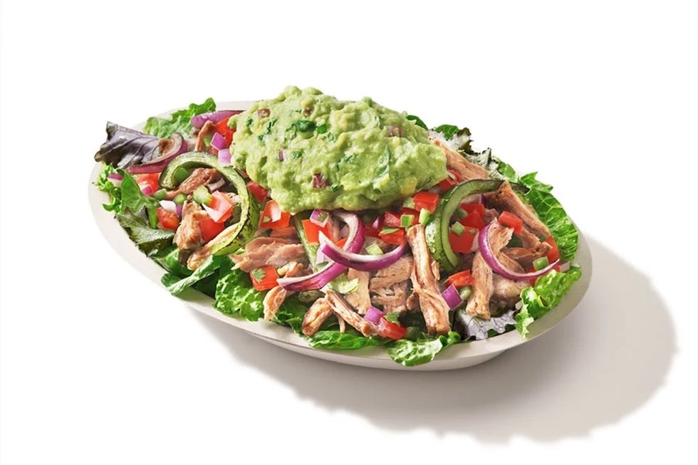 platter of salad with guacamole and various toppings