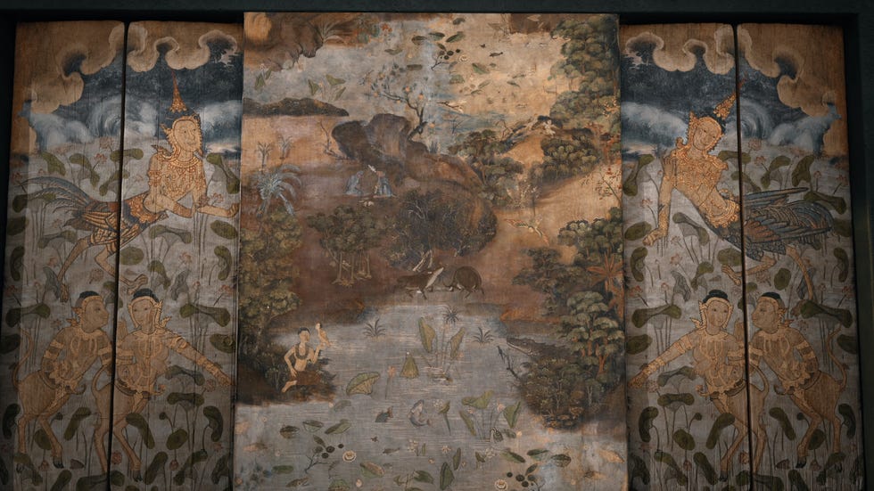 historical mural depicting figures and nature