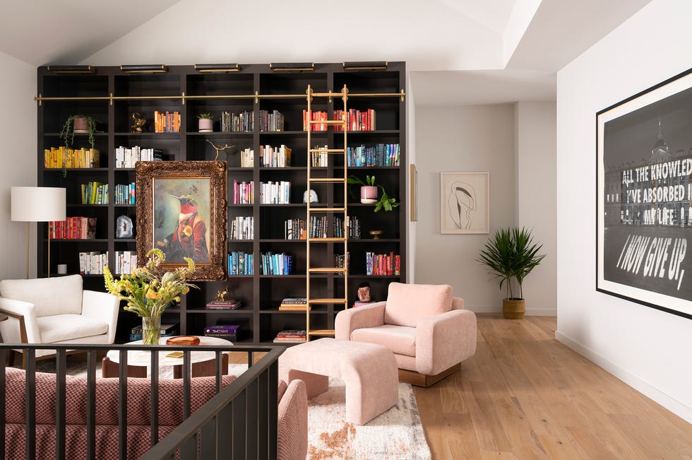 a room with a bookcase and a couch