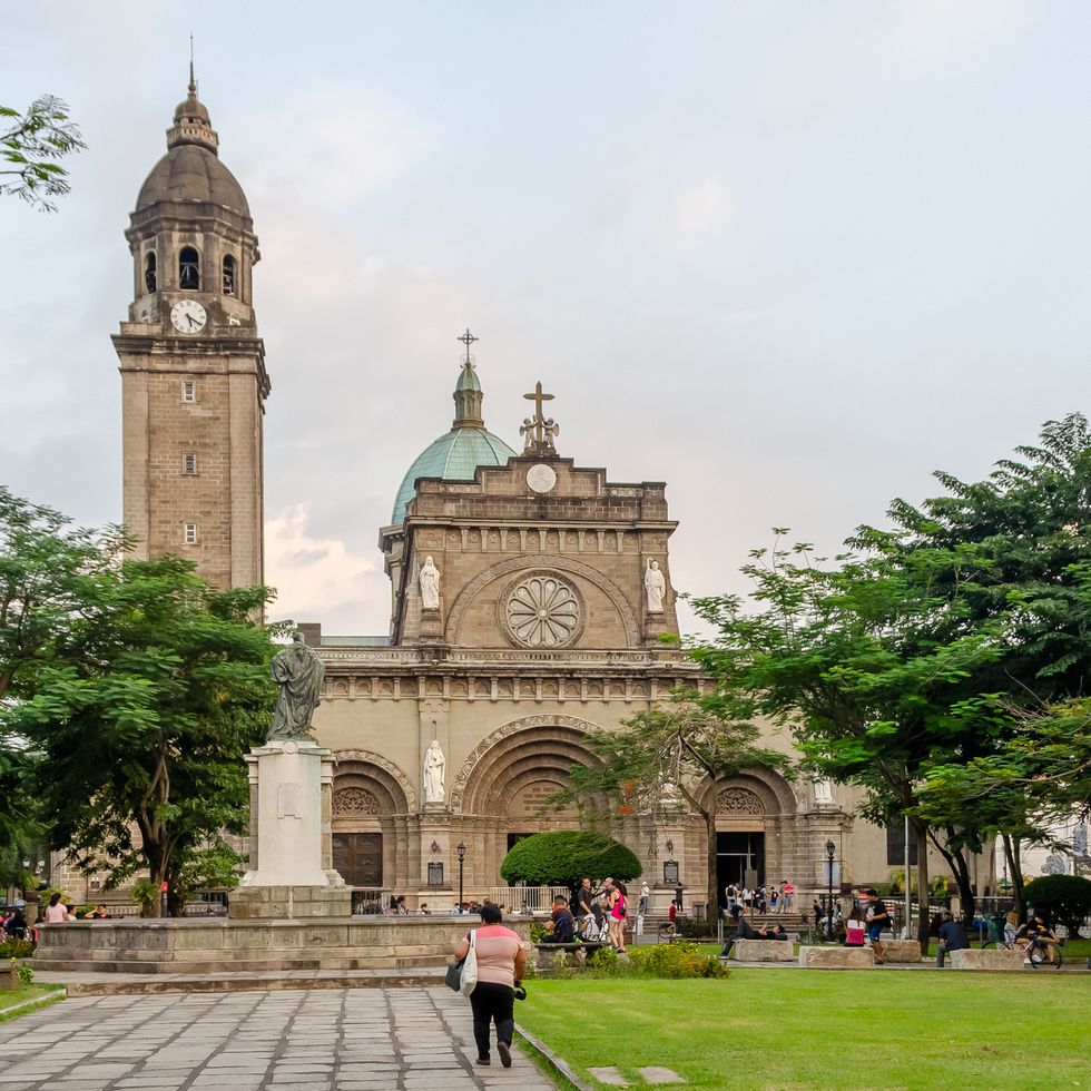 wide shot tourist visit cathedral intramuros manila, philippines