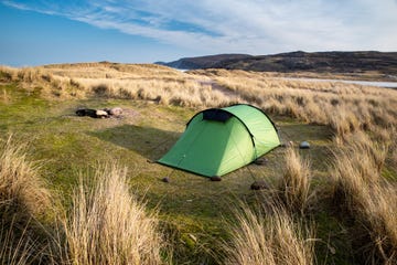 a tent in a grassy field