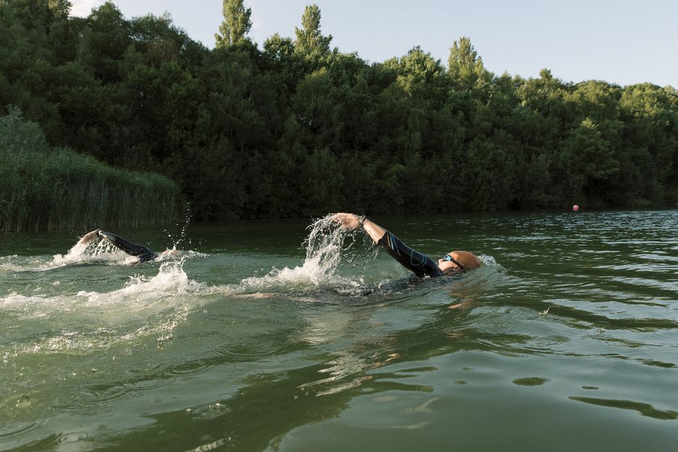 two female freestyle open water swimmers racing
