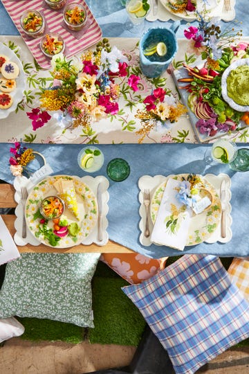 spring party placesetting with blue tablecloth and daisy bordered plate