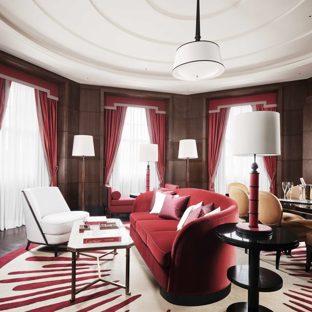a living room with red furniture