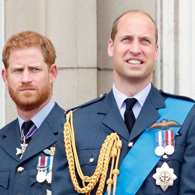 prince harry and prince william watch a flypast to mark the centenary of the royal air force from the balcony of buckingham palace in london