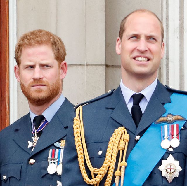 prince harry and prince william watch a flypast to mark the centenary of the royal air force from the balcony of buckingham palace in london