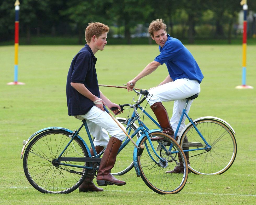 wiltshire, united kingdom july 13 britains prince harry l and prince william participate in the bicycle portion of the jockeys vs eventers charity polo match july 13, 2002 at tidworth polo club, wiltshire, united kingdom prince harry, 17, has been accused by a british tabloid of under age drinking during a party july 12, 2002 the office of prince charles, harrys father, has said that the claims were exaggerated photo by uk press getty images